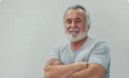 Man smiling with crossed arms